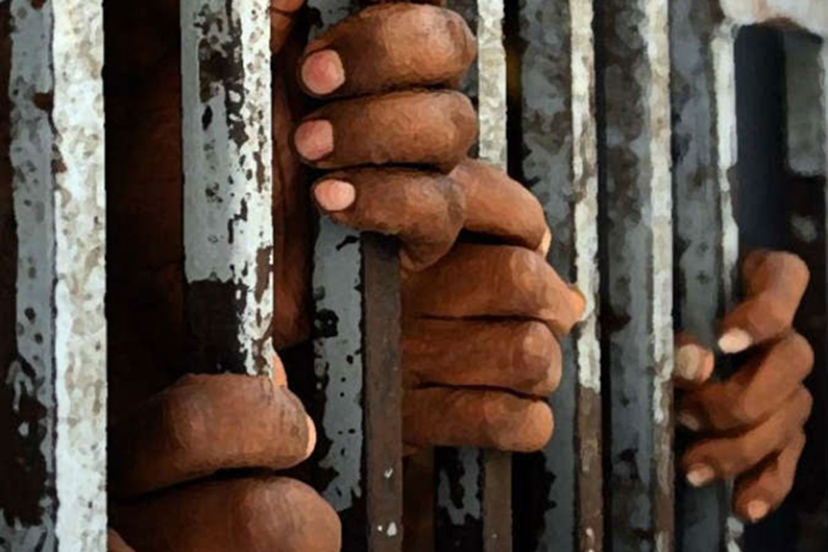 prison-jail-hands-bar.jpg