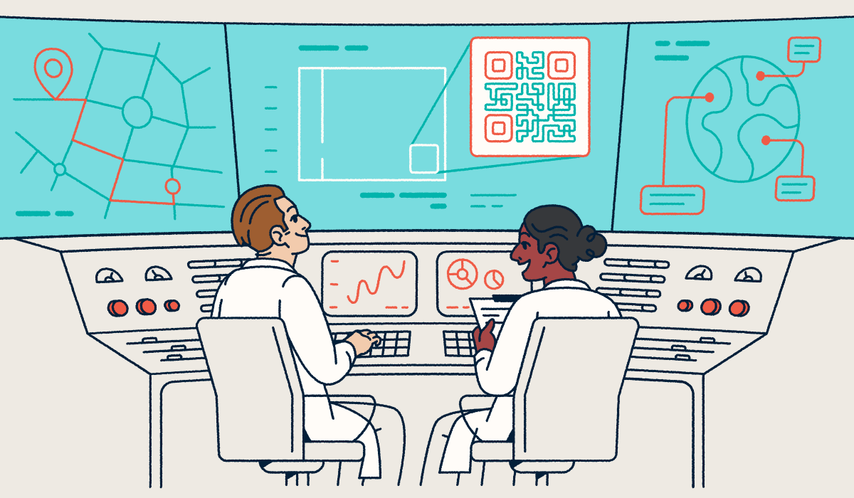 Deux scientifiques assis devant un pupitre, les yeux rivés sur des écrans affichant des codes QR et des graphiques.