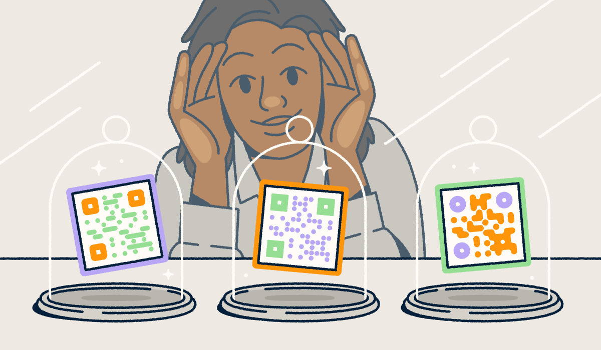 A person looking through a store-front window at three different QR codes on display in glass cloches.