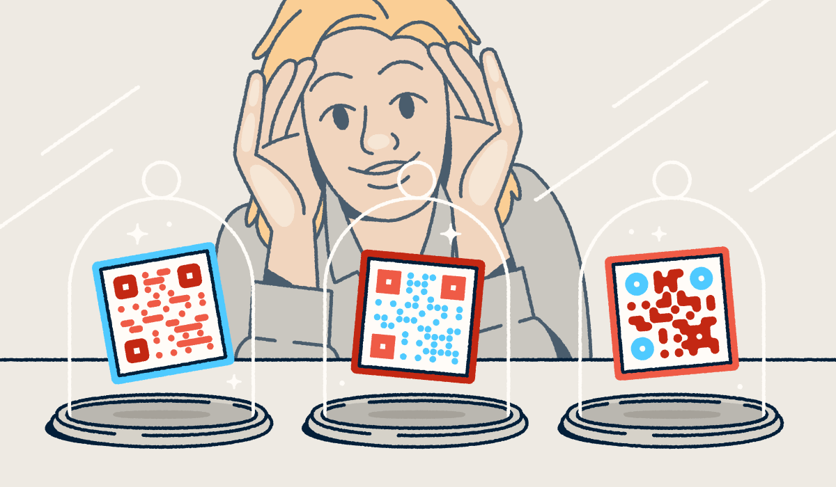 A person looking through a store-front window at three different QR codes on display in glass cloches.