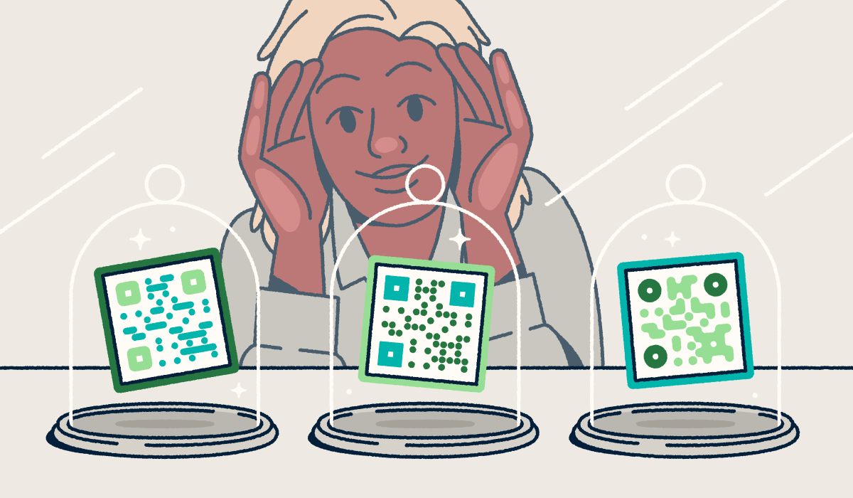 A person looking through a store-front window at three different QR codes on display in glass cloches.