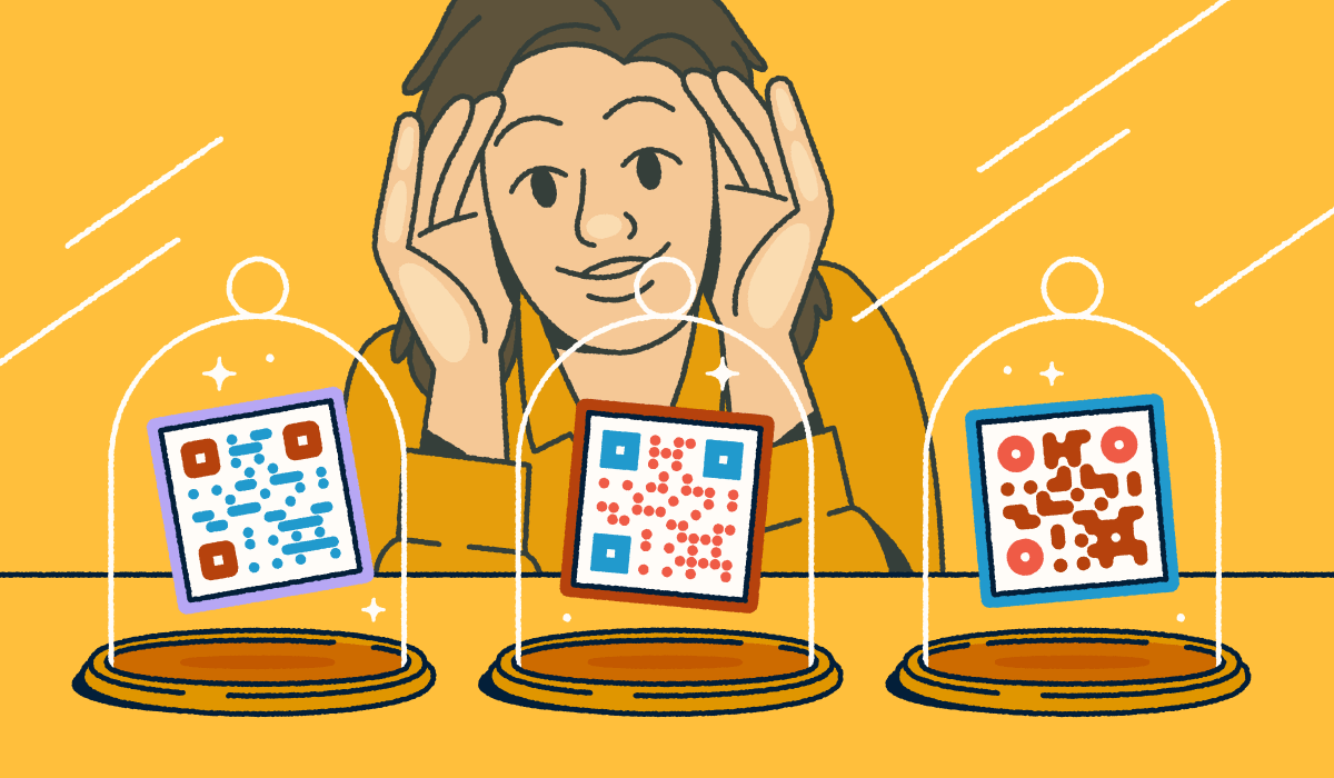 A person looking through a store-front window at three different QR codes on display in glass cloches.