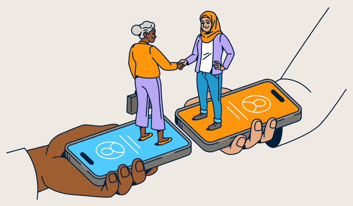 Zwei Menschen, die auf ihren Smartphones stehen und sich die Hand geben.