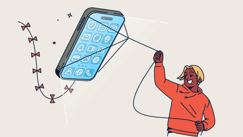 A person flying a mobile phone like a kite.