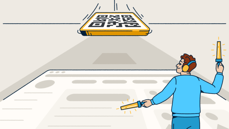 A person waving airport marshalling wands on a landing strip. They are guiding a QR Code to land.