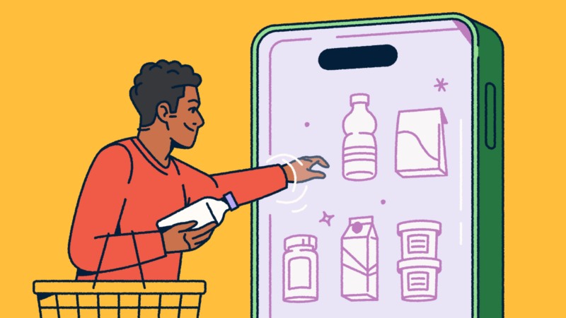 A person holding a shopping basket and selecting consumer packaged goods from a mobile "fridge."