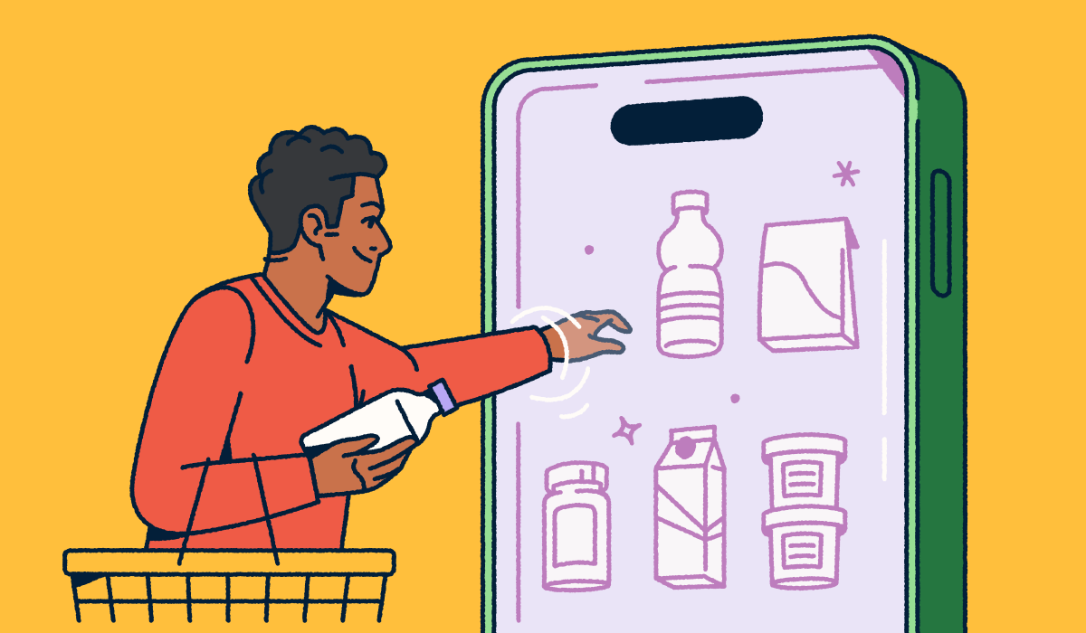 A person holding a shopping basket and selecting consumer packaged goods from a mobile "fridge."