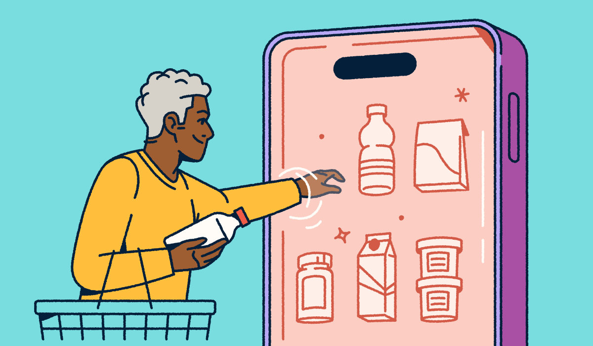 A person holding a shopping basket and selecting consumer packaged goods from a mobile "fridge."