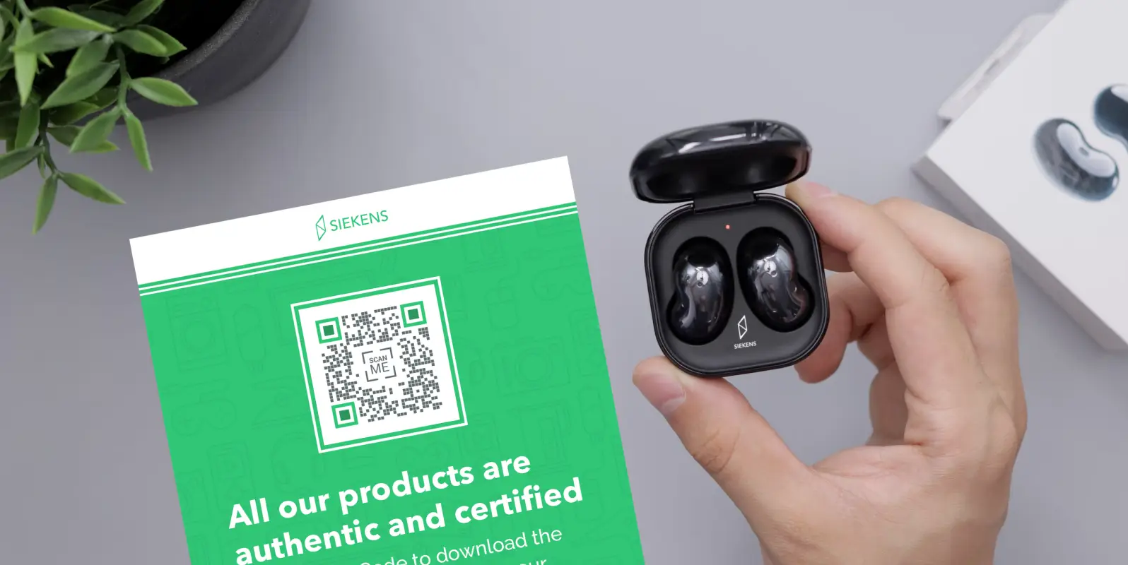 Closeup of a product authentication card with a QR Code on it and a hands holding an open case with bluetooth earphones in it.