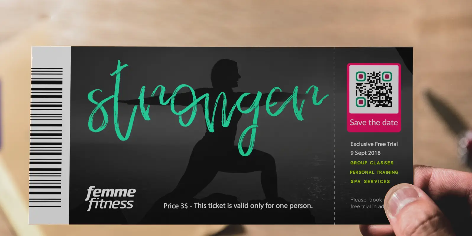 A ticket stub for a workout class. There is a QR Code in the top right corner that allows users to save the date.