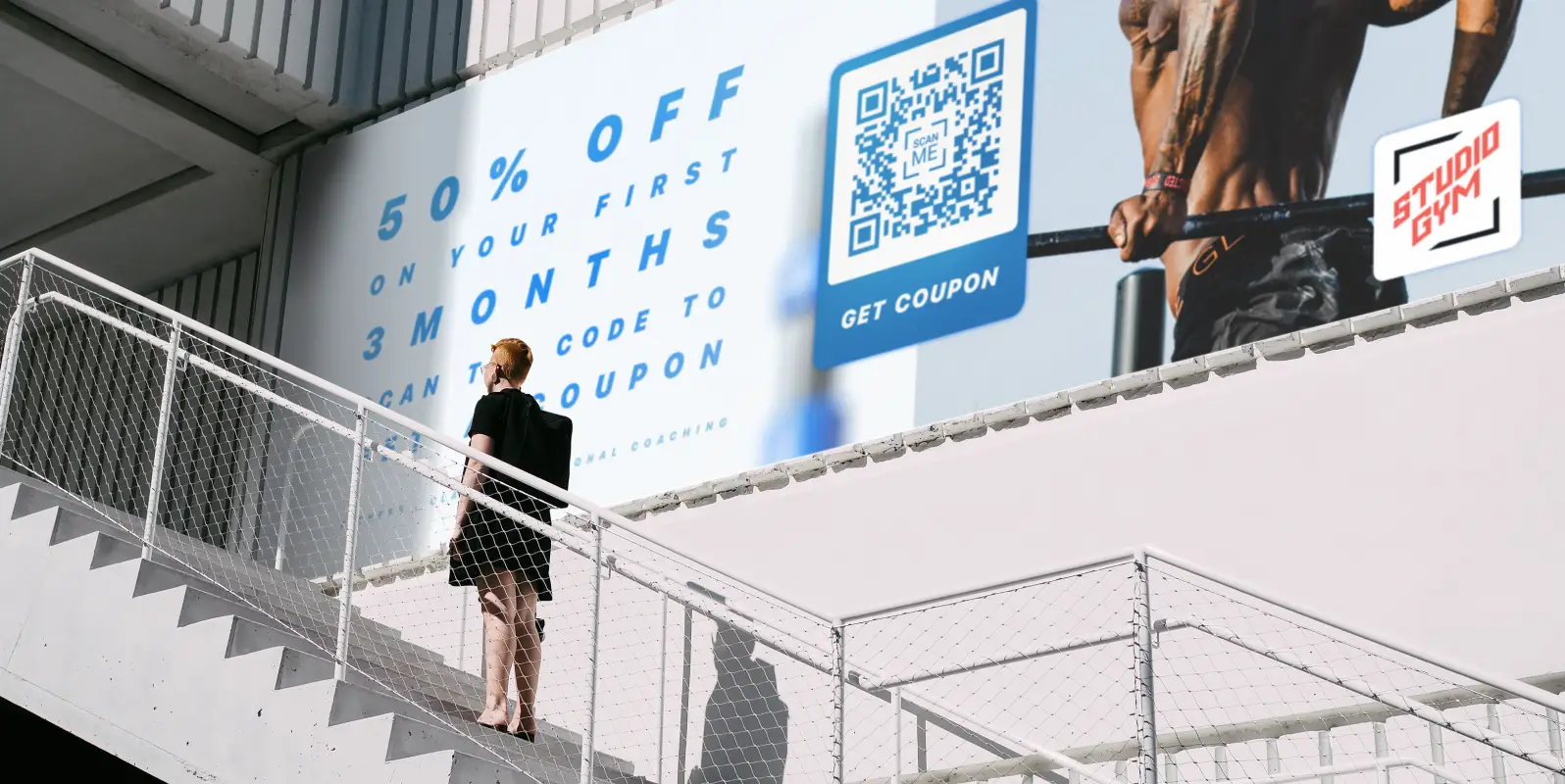 A large banner advertisement for a discount coupon for a gym membership, accessed via QR Code.