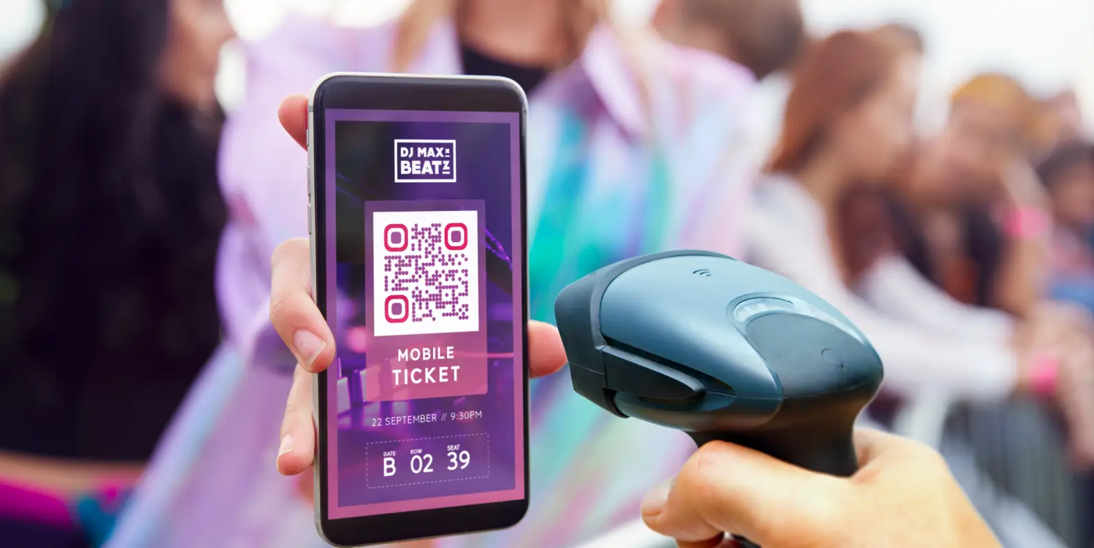 A hand with a scanner tool that is scanning a QR Code ticket on a mobile phone.