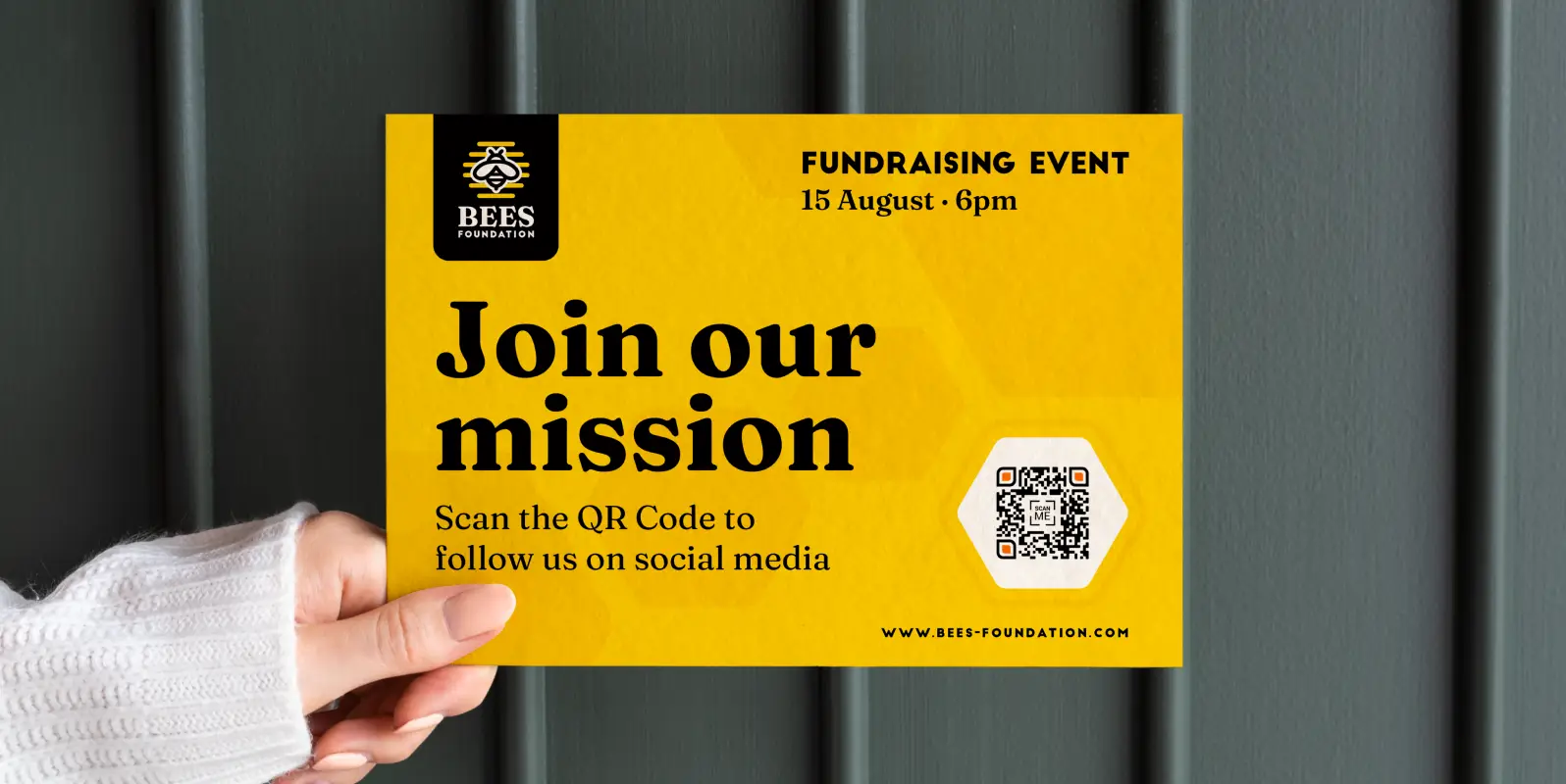 A hand holding a flyer for a fundraising event. A QR Code links to the foundation's social media.