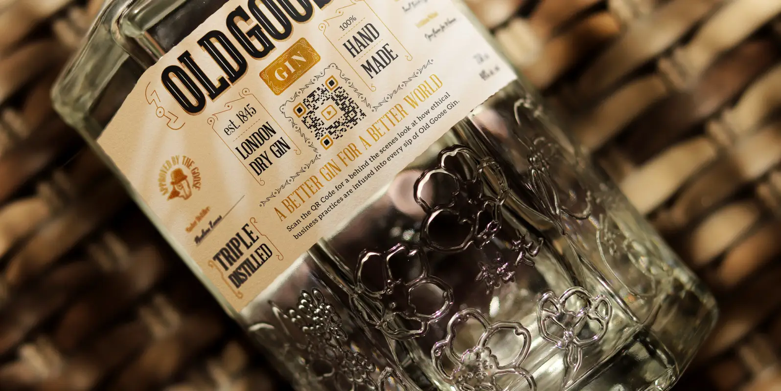 Closeup of a gin bottle and label featuring a QR Code.